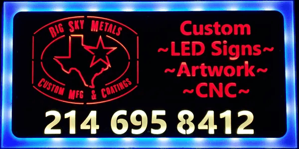 Big Sky Metals LED backlit shop sign showing custom LED signs, artwork, CNC, and the shop phone number